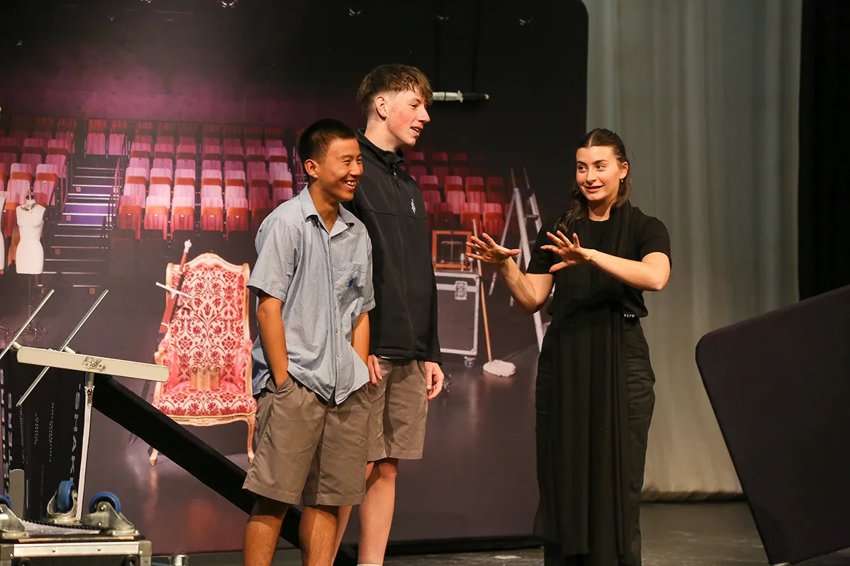 2 students doing a performance for English